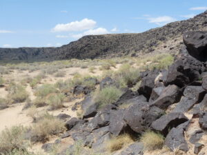 Photo of hills, rocks and dirt and the Petroglyph National Monument in Albuquerque.