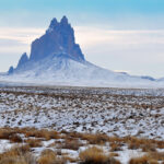 Photo of Shiprock on a snowy day.