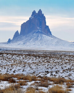 Photo of Shiprock on a snowy day.